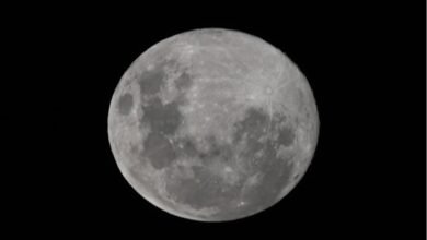 Why is the moons surface asymmetrical?
